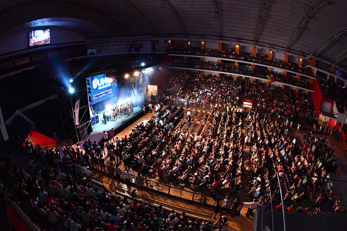 A large crowd watches on