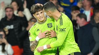 Alejandro Garnacho is congratulated by Cristiano Ronaldo after scoring for Manchester United against Real Sociedad in 2022.