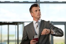 UK passport renewal: Man with passport at airport