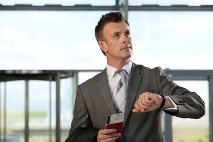 UK passport renewal: Man with passport at airport