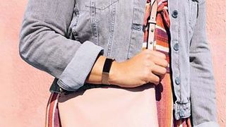 A woman's wrist wearing the Fitbit Inspire 2