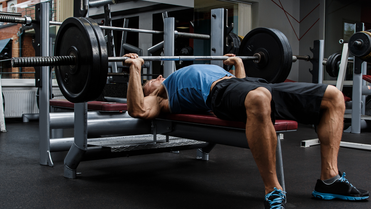 Man performing bench press