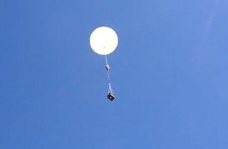 A shot of a previous Quest for Stars balloon mission rising toward the edge of space.