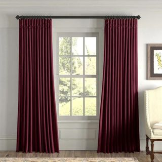 Signature Velvet Curtains against a gray wall.