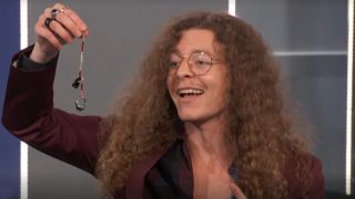 Quinn Martin holding his immunity idol in Big Brother