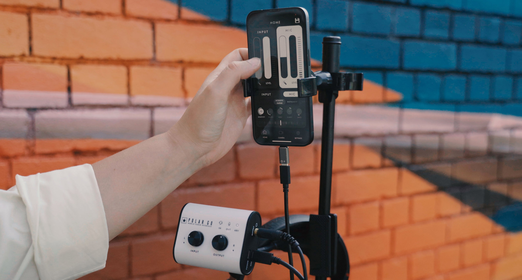 Blackstar Amplification Polar Go: the super-compact audio interface has a white fascia, black knobs and sides, and is small enough to fit inside the palm of your hand.