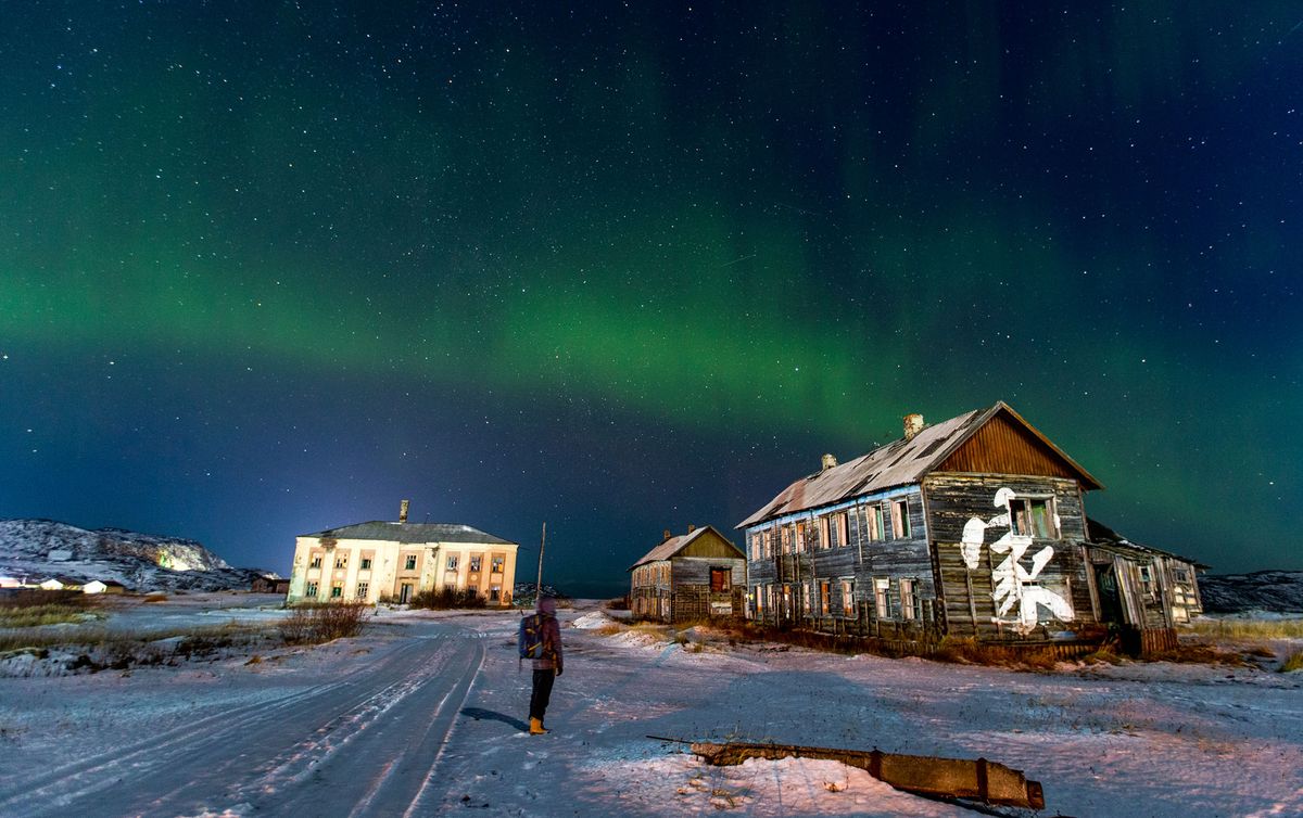The northern lights are seen over Teriberka, Russia, a village with the population of about 1,000 people, located some 120 km away from the city of Murmansk on the Russian Arctic coast on Oct. 30, 2021.