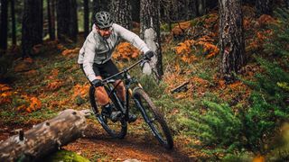 Rider on the Mondraker Chrono Carbon DC in the woods