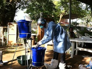 Person wearing protective Ebola gear