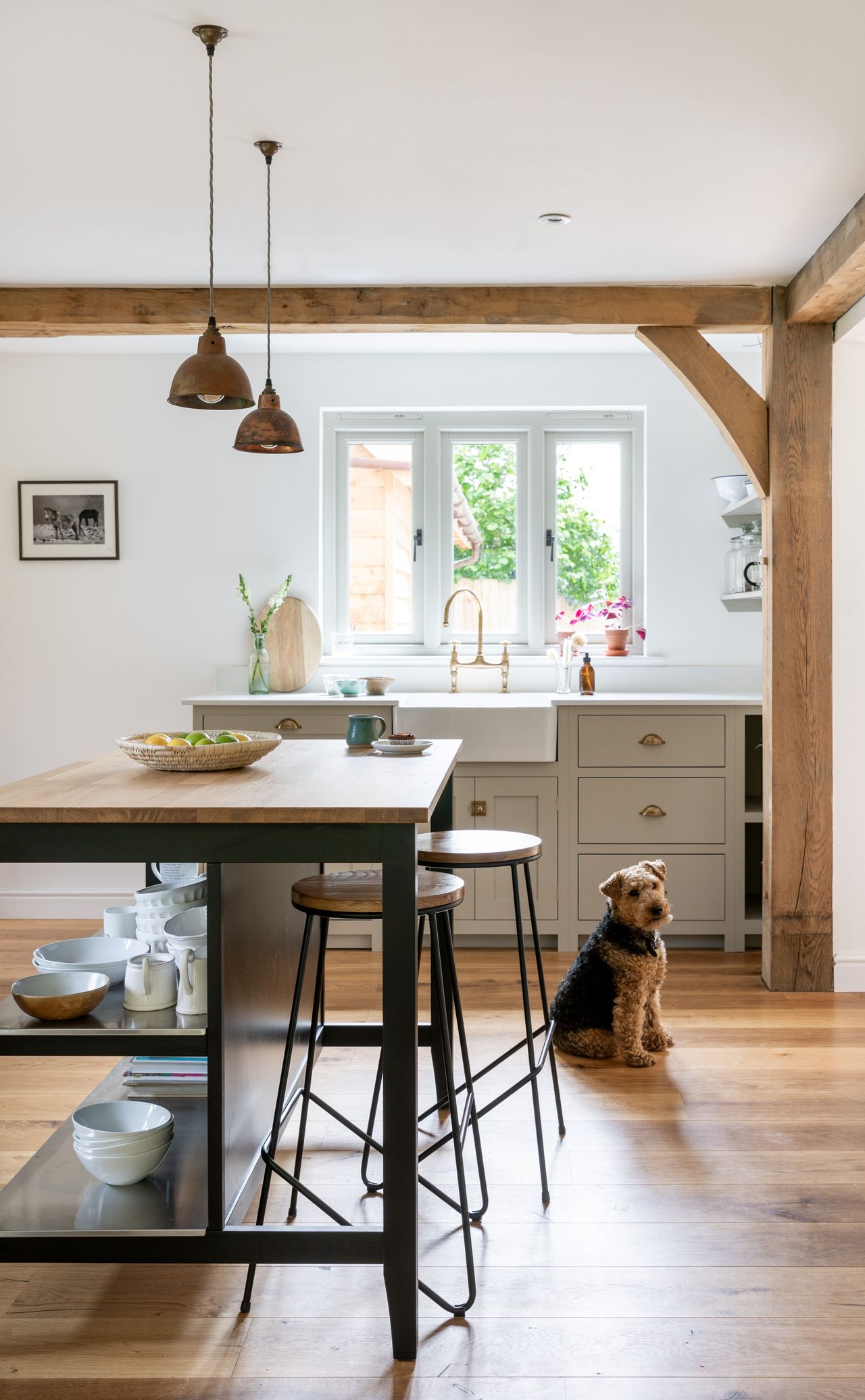 kitchen with island in oak frame home