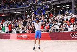 Filippo Ganna celebrates winning gold in the team pursuit