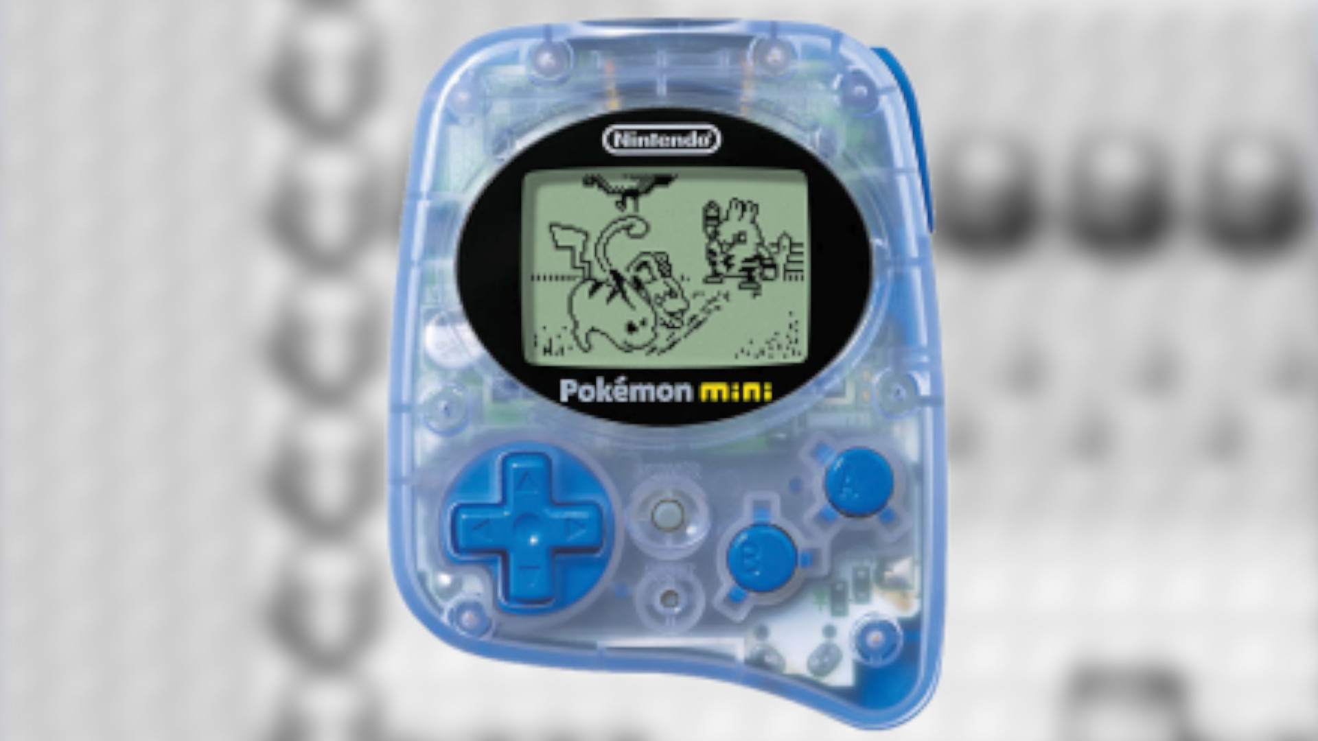 A Pokemon Mini console in front of a blurred background
