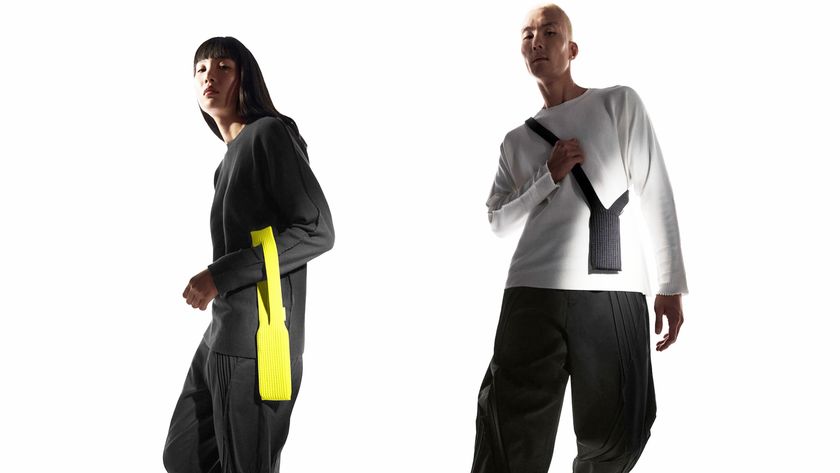 Two people modelling the iPhone Pocket, with one wearing it over an arm and the other wearing it around their shoulder