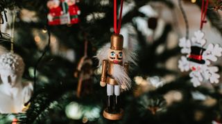 picture of traditional wooden christmas decorations on Christmas tree