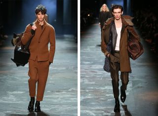 A front on view of the same catwalk but different models wearing brown clothing carrying holdalls