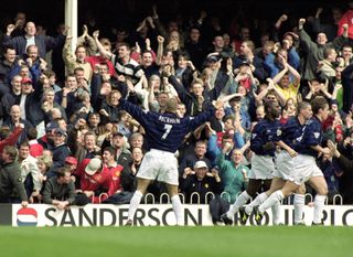 David Beckham celebrates with the Manchester United fans after scoring against Southampton in 2000.