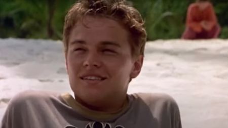 A close up of Leonardo DiCaprio smiling in the beach in The Beach