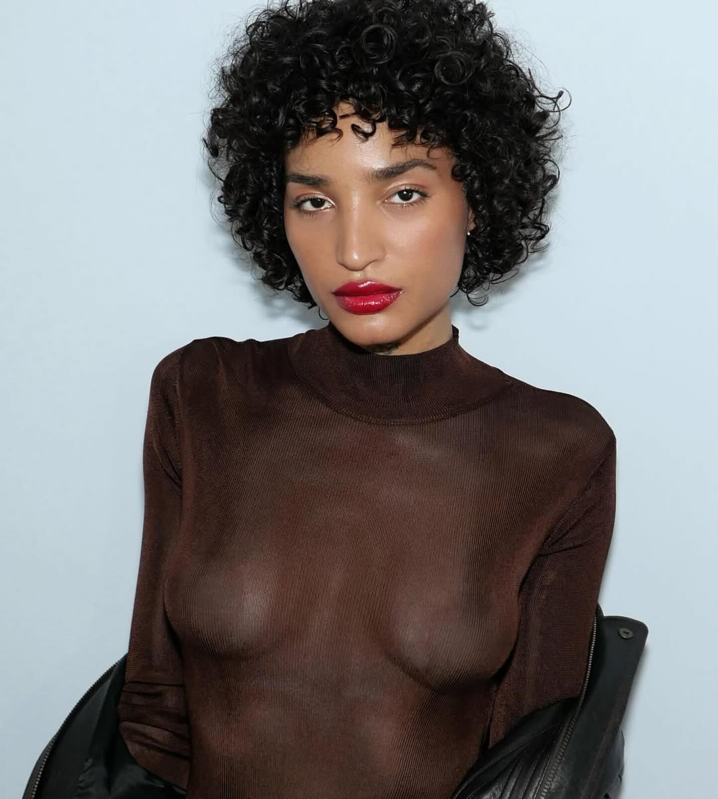 Indya Moore with curly bob
