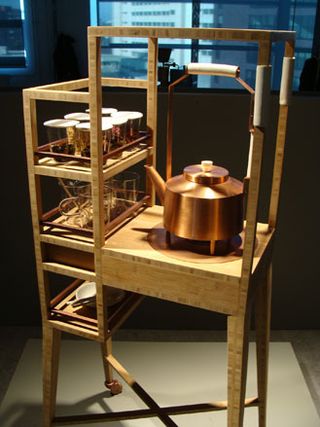 Wooden tea trolley with copper kettle