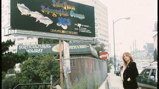 Howe poses near a Topographic Oceans billboard advert in one of Roger Dean’s photos from the early part of 1974’s U.S. tour.
