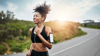 woman running along road