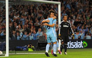 Sergio Aguero celebrates on his Manchester City debut against Swansea