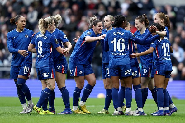 LONDON, ENGLAND - FEBRUARY 08: Alyssa Thompson of Chelsea (obscured) celebrates scoring her team's second goal with teammates during the Barclays Women's Super League match between Tottenham Hotspur and Chelsea FC at BetWright Stadium on February 08, 2026 in London, England. (Photo by James Fearn/Getty Images)