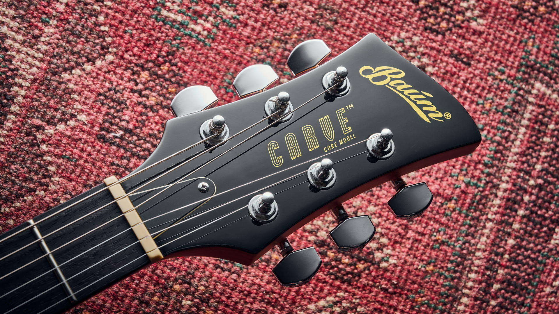 The headstock of the Baum Carve electric guitar