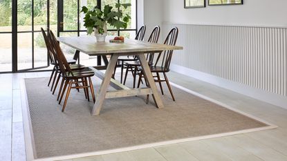 Riviera Home UK Medina Basket Weave 221 Peanut rug with Camel and Sand TufStrand border in a dining room