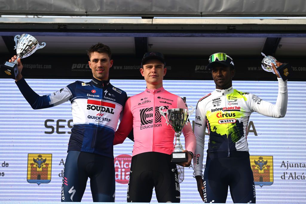 ALCUDIA SPAIN JANUARY 26 LR Ethan Vernon of The United Kingdom and Team SoudalQuick Step on second place race winner Marijn van den Berg of The Netherlands and Team EFEasyPost and Biniam Girmay of Eritrea and Team IntermarcheCircus on third place pose on the podium ceremony after the 32nd Challenge Ciclista Mallorca 2023 Trofeo Ses Salines Alcdia a 1586km one day race from Ses Salines to Por DAlcdia ChallengeMallorca on January 26 2023 in Alcudia Spain Photo by Dario BelingheriGetty Images