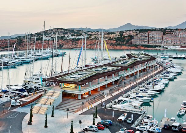 Busy harbour with mountains in the background