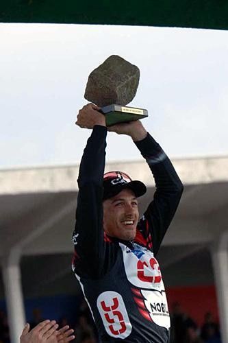 Fabian Cancellara (CSC) lifts the stone