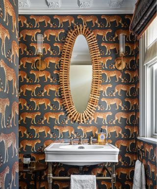 Wallpaper ideas in the powder room, with a charcoal gray cheetah print wallpaper.