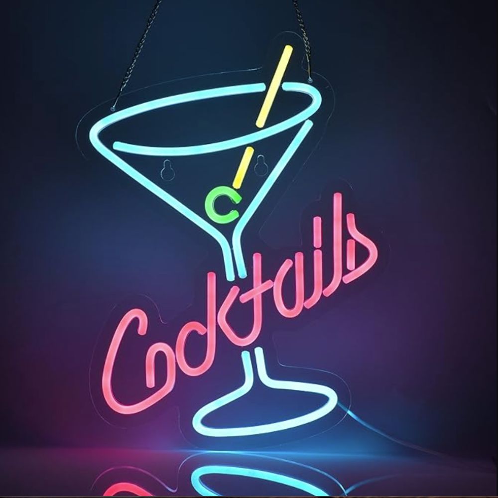 Neon sign in the shape of a cocktail glass with the word cocktails across the middle