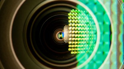 A camera lens with lens flair giving