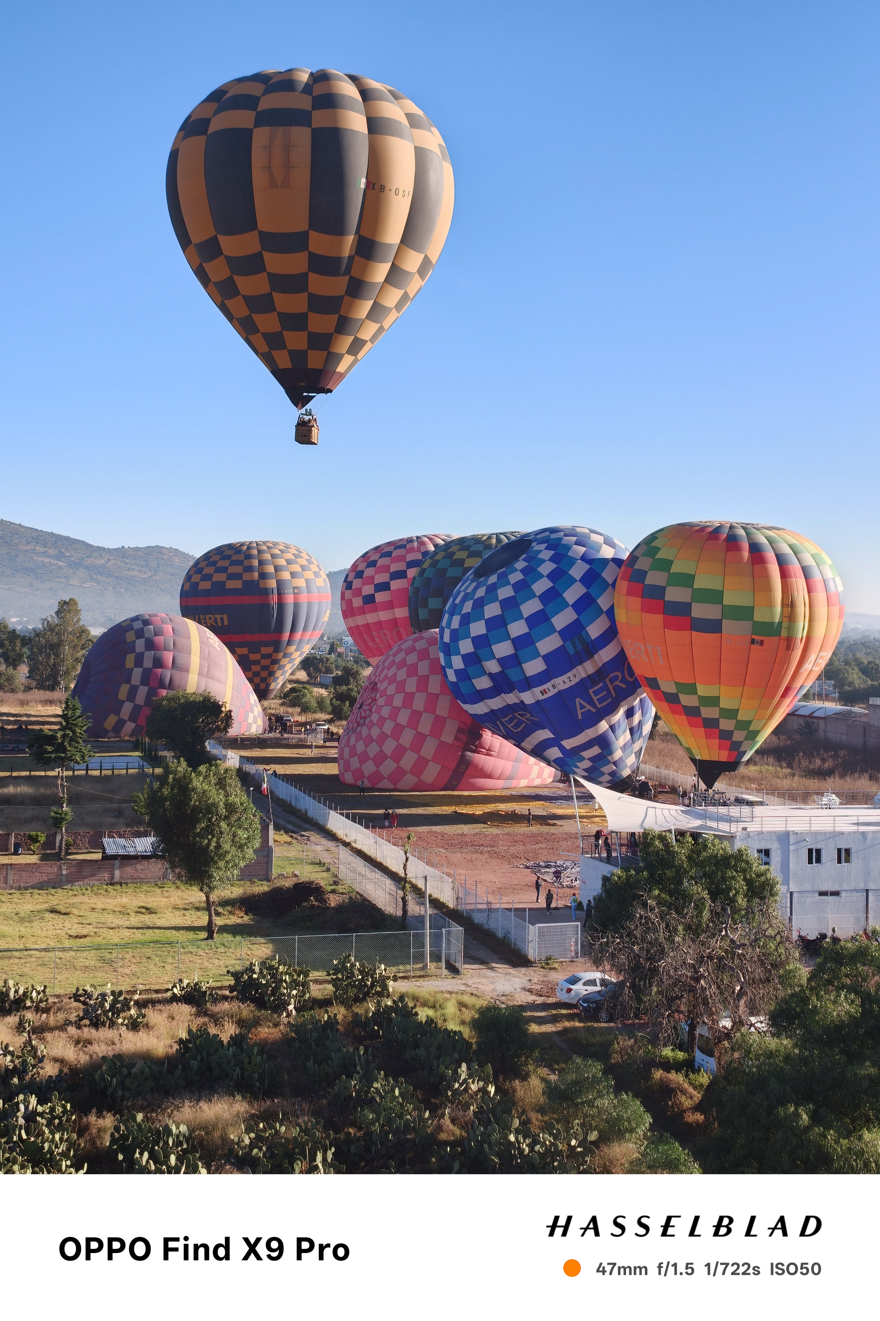 A series of hot air balloons inflating and taking off from the ground
