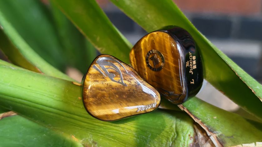 A selection of photos of the Juzear Harrier in-ear monitor, amongst green plants and coffee cups. 