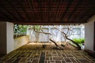 looking out from sheltered walkway at Ena de Silva house by Geoffrey Bawa in Sri Lanka