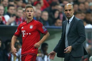 MUNICH, BAVARIA - APRIL 05: Josep Guardiola, head coach of Bayern Muenchen reacts with his player Joshua Kimmich during the UEFA Champions League quarter final first leg match between FC Bayern Muenchen and SL Benfica at Allianz Arena on April 5, 2016 in Munich, Germany. (Photo by Alexander Hassenstein/Bongarts/Getty Images) Manchester City