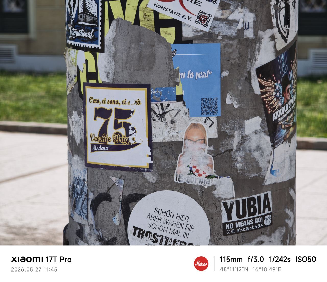 A stickered lamppost in Vienna