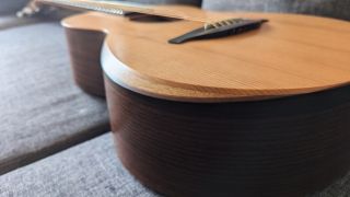 Close up of the arm rest bevel on a Sheeran by Lowden W05 acoustic guitar