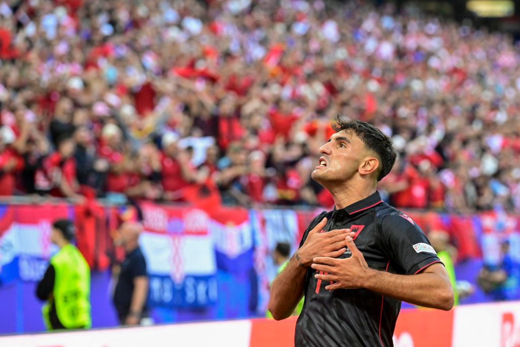 Albania&#039;s midfielder #14 Qazim Laci celebrates scoring the opening goal with fans during the UEFA Euro 2024 Group B football match between Croatia and Albania at the Volksparkstadion in Hamburg on June 19, 2024