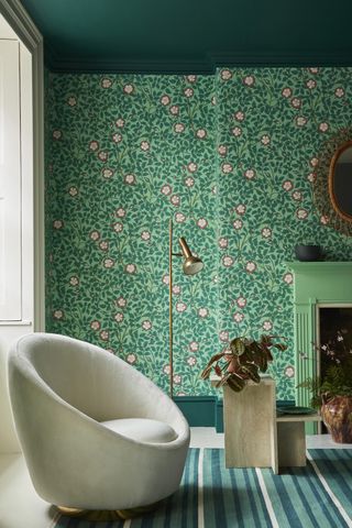 living room with green floral wallpaper