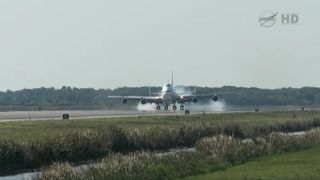 NASA's modified Boeing 747 Shuttle Carrier Aircraft lands at the Kennedy Space Center in Florida on April 10, 2012.