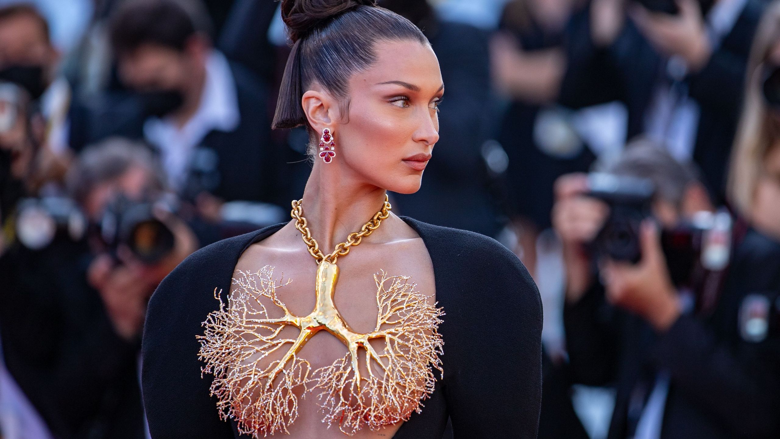 bella hadid gold lung dress Bella Hadid wears daring Schiaparelli lung dress to Cannes 2021