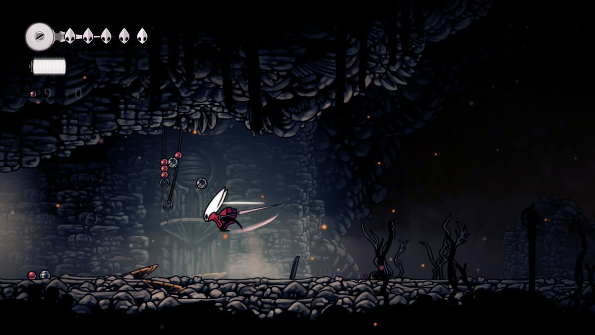 Hornet slashes hanging rosary beads in Hollow Knight: Silksong