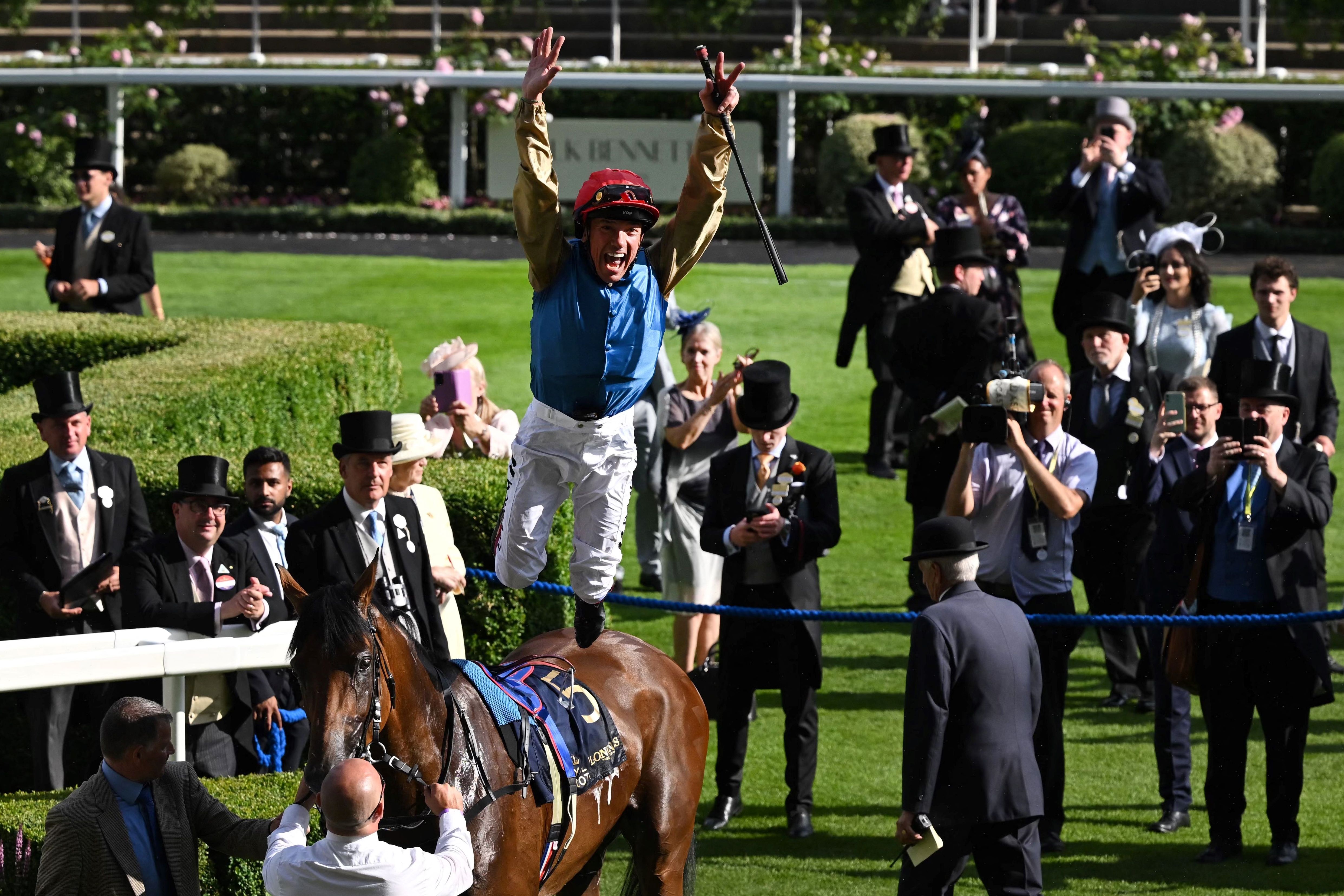 Jockey jumping off his horse at Royal Ascot