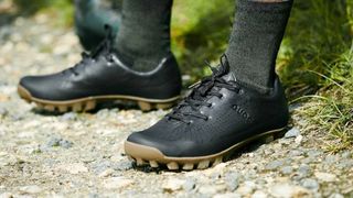 The best gravel bike shoes in the form of a black pair of Quoc Gran Tourer gravel bike shoes