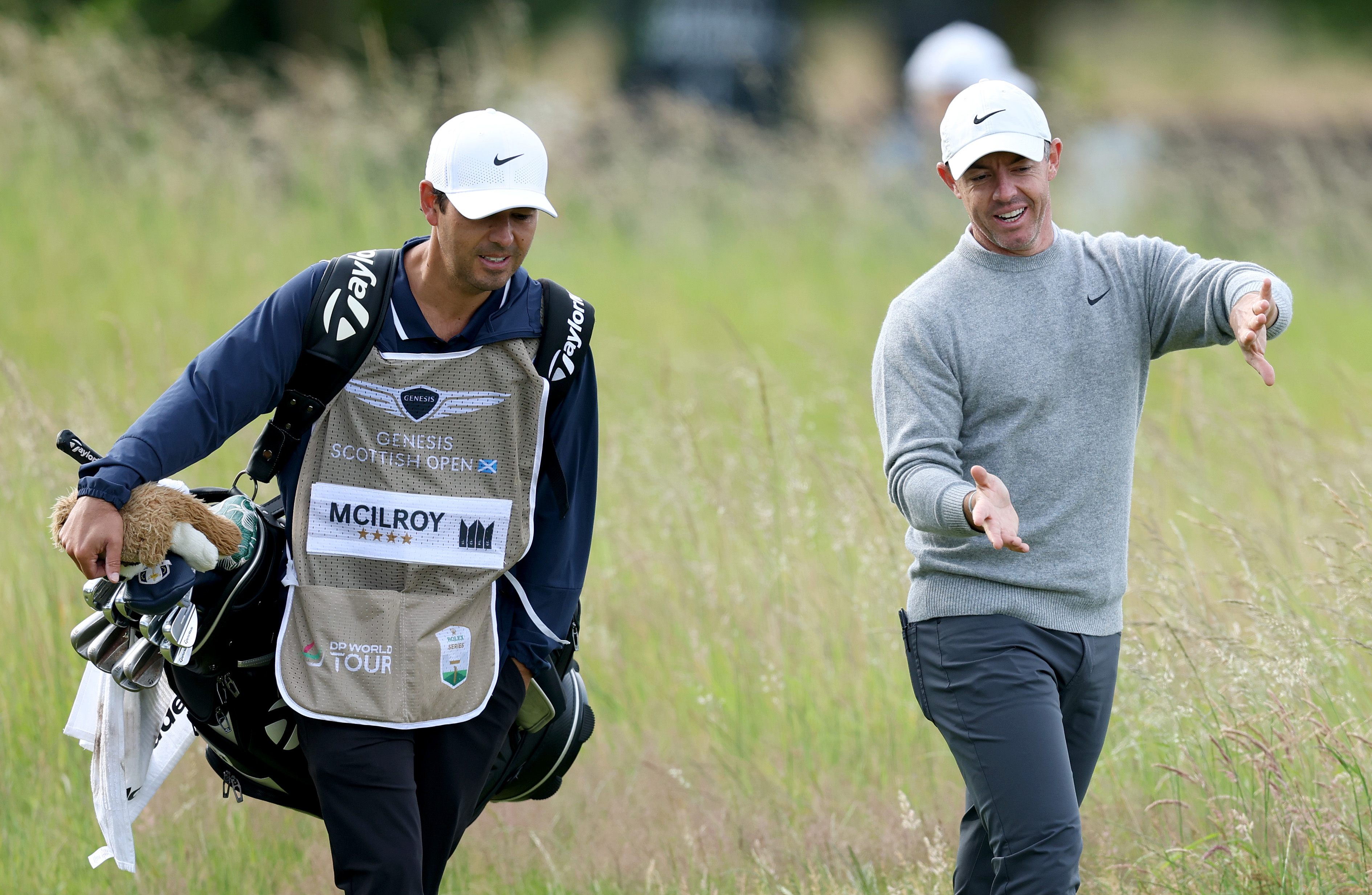 Rory McIlroy speaks to his caddie