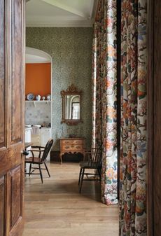 William Morris’s Willow Bough wallpaper and Magnolia fabric by G. P. & J. Baker lend a friendly formality to the kitchen at Chettle, Dorset.